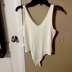 Ribbed white bodysuit. Only worn twice.